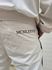 Original UVP 280€ Carlo Colucci  Jogging Anzug creme schwarz Farbspritzer