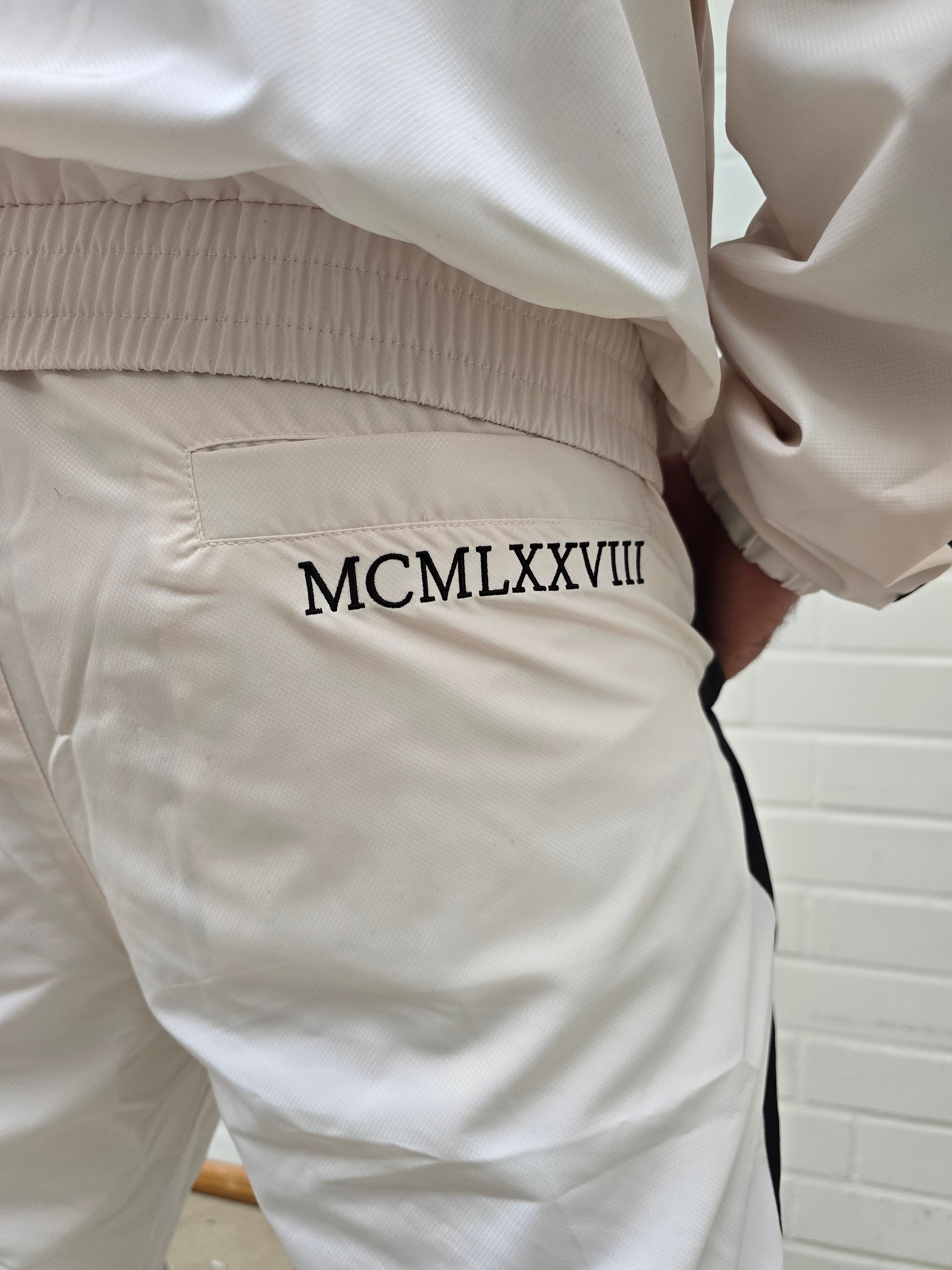 Original UVP 280€ Carlo Colucci  Jogging Anzug creme schwarz Farbspritzer